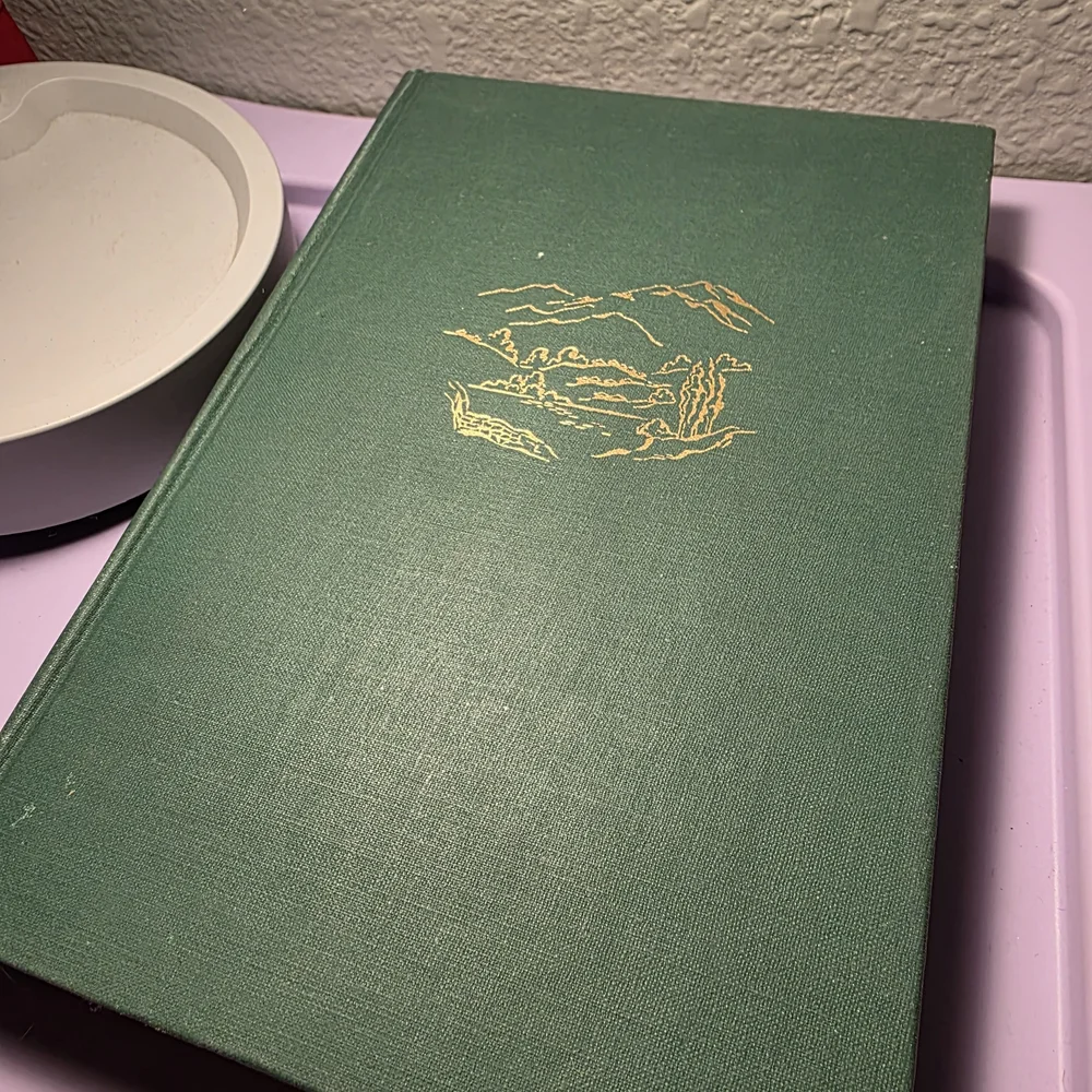 Green Hardcover Book with Gold Design